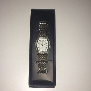 Sliver and gold watch with crystals